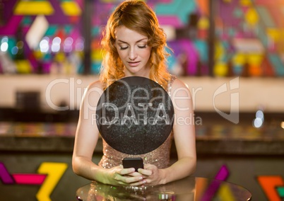 Data text in circle against woman with phone in club