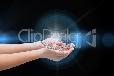 Digital composite of Brain on hands