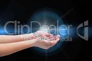 Digital composite of Brain on hands