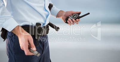 security guard with walkie-talkie and cuffs. blurred back