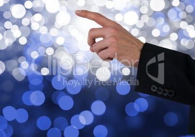 Hand pointing with sparkling light bokeh background