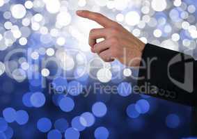 Hand pointing with sparkling light bokeh background