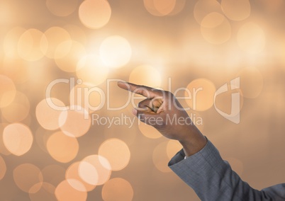 Hand pointing angular with sparkling light bokeh background