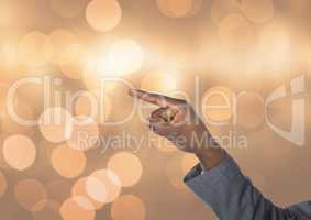 Hand pointing angular with sparkling light bokeh background
