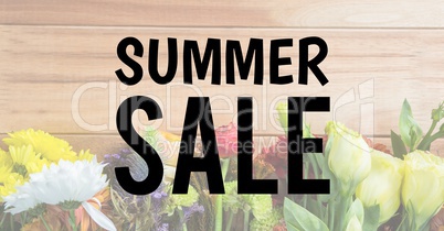 Black summer sale text against faded image of flowers on table
