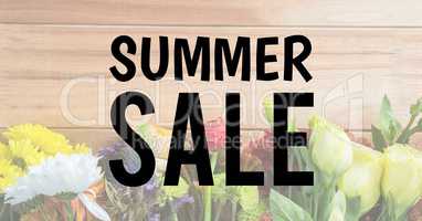 Black summer sale text against faded image of flowers on table