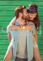 happy hippy couple with green wood background