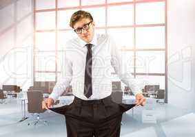 Businessman showing empty pockets while standing in office