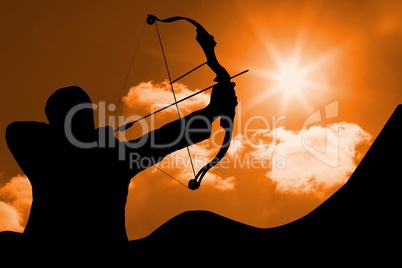 archer shadow is shooting an arrow against sunset background