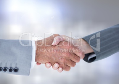 Hands shaking with sparkling light bokeh background