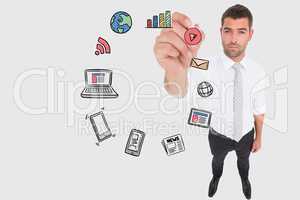 Business man drawing colored icons on the screen against white background
