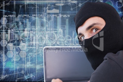 Hacker using his computer with cover face