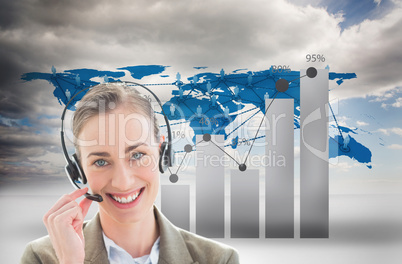 Businesswoman wearing Head set against graphics and world wide map background