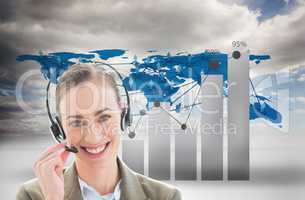 Businesswoman wearing Head set against graphics and world wide map background