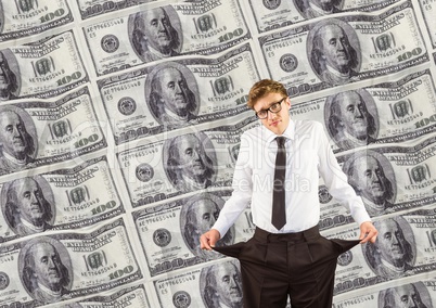 Young businessman with empty pockets. money background