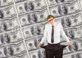 Young businessman with empty pockets. money background