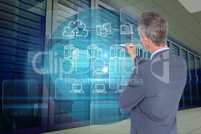 Businessman drawing icons from the back against database background