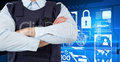 Policeman with his hands crossed standing on in front of digital wall