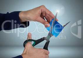 Hands cutting bank card with scissors