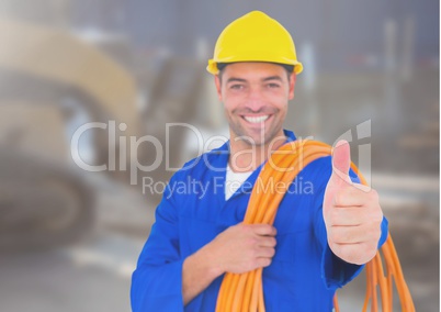 Electrician with wires cables on building site