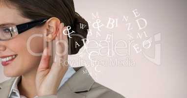 Cropped image of businesswoman listening alphabets
