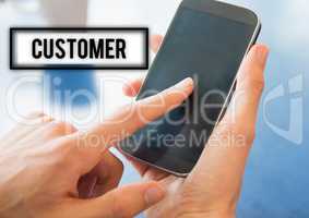 Hands holding smart phone with customer text