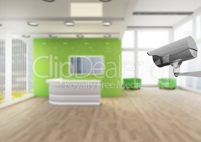 CCTV controlling a green office (blurred)