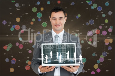 A businessman is holding a laptop against interface graphics background