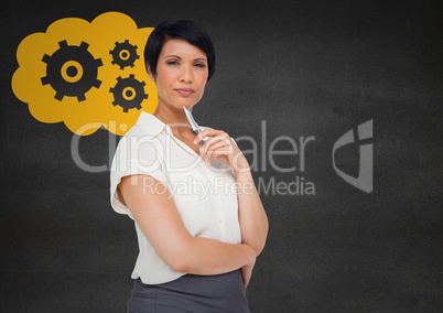 Business woman thinking against grey wall and yellow cloud with gear graphic