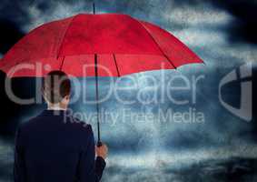 Back of business woman with umbrella in against storm with grunge overlay