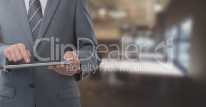 Businessman holding tablet in office