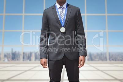 a business man is wearing a medal on building's windows background