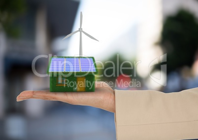 solar panel house and windmill on hand  in the city