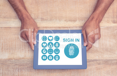 Hands holding a tablet with icons