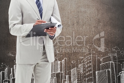 Businessman against grunge wall with city drawing