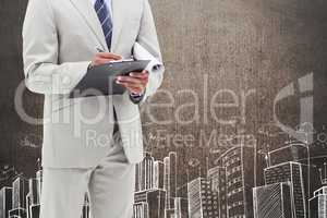 Businessman against grunge wall with city drawing