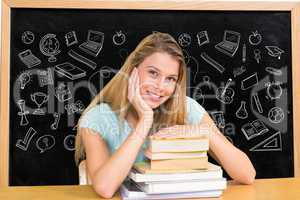 Student against black board with graphics