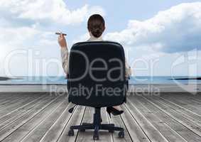 Businesswoman Back Sitting in Chair with cigar and sea view