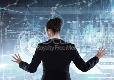 Businesswoman in a futuristic room interface.