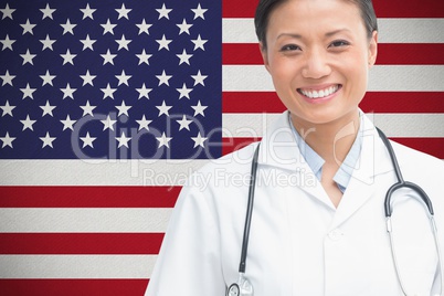 doctor smilling against american flag