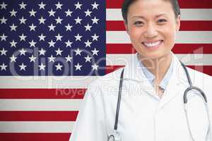 doctor smilling against american flag