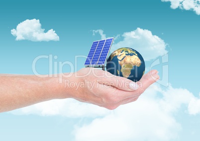 solar panel  and earth on hand in the sky