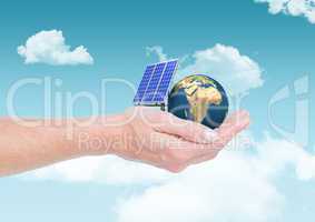 solar panel  and earth on hand in the sky