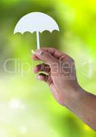 Cut out of umbrella in hand in nature
