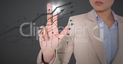 Business woman mid section touching grey graph with flare against grey background