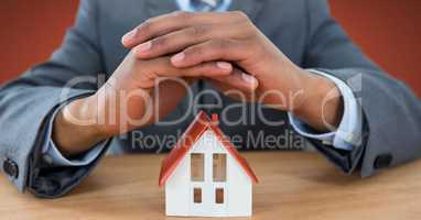 House model protected by models hands