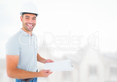 Construction Worker with chart in front of construction site