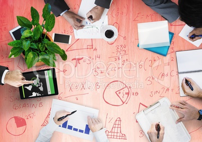 Overhead of business team with red wood panel and math doodles