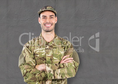 happy soldier with cup. concrete wall