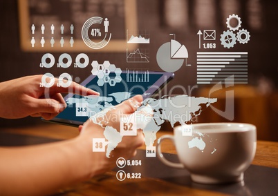 Hands of a man working on a tablet with digital graphics